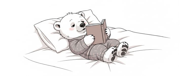 布団の中で横になって本を読んで眠ってしまいそうなシロクマのキャラクター